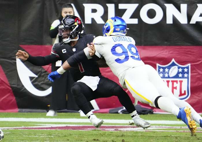 Nov. 26, 2023; Arizona Cardinals quarterback Kyler Murray (1) is sacked by Los Angeles Rams defensive tackle Aaron Donald (99). © Rob Schumacher/The Republic / USA TODAY NETWORK